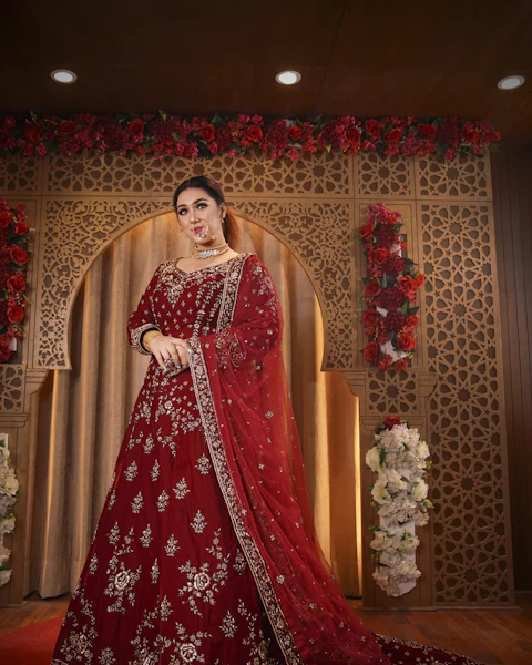 Bride in a red embroidered wedding lehenga