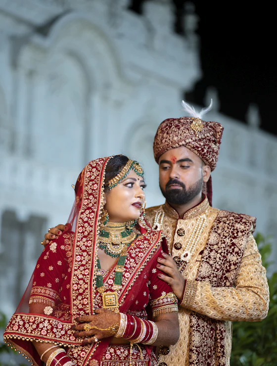 Couple in coordinated traditional wedding outfits