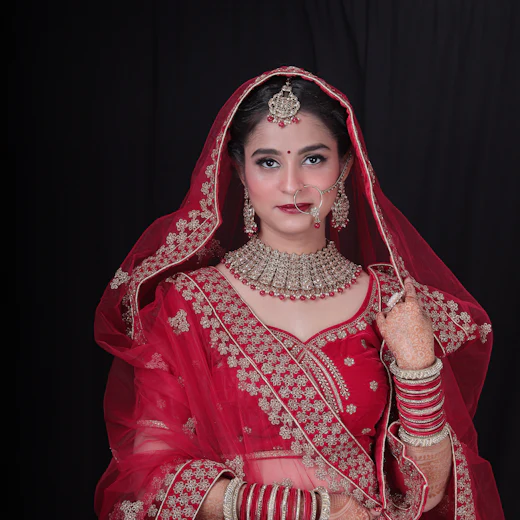Bride in a deep red bridal lehenga